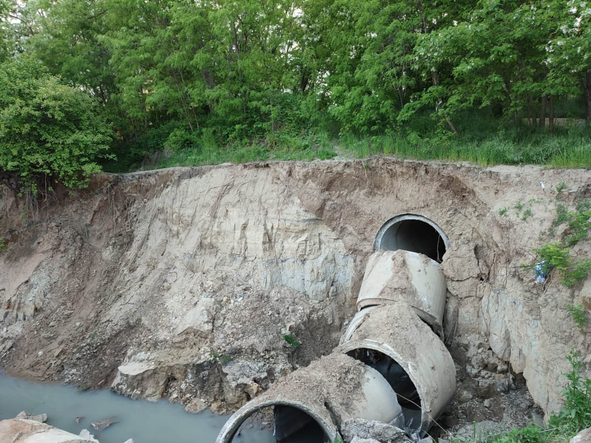 large-pipe-is-dirt-word-water-is-side-pipe colapsed covert pipe from soil loss