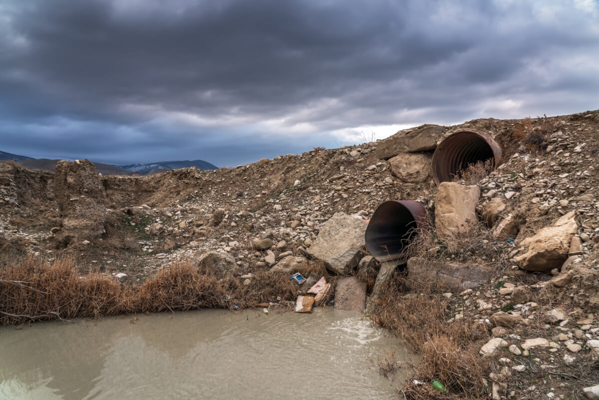 culvert pipes running under loosely compacted roadway