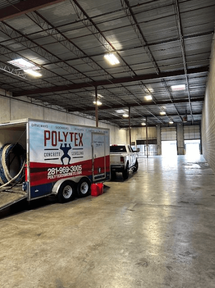 warehouse floor being fixed by PolyTex Leveling warehouse concrete floor settlement